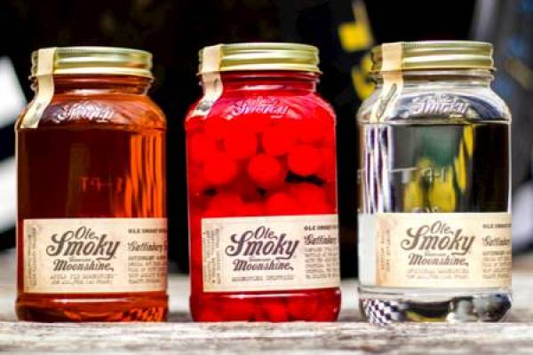 Three mason jars with moonshine